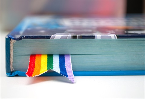 Book with rainbow pattern bookmark