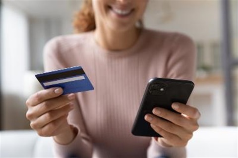 lady on phone with credit card