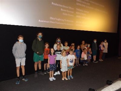 Kids in front of cinema screen