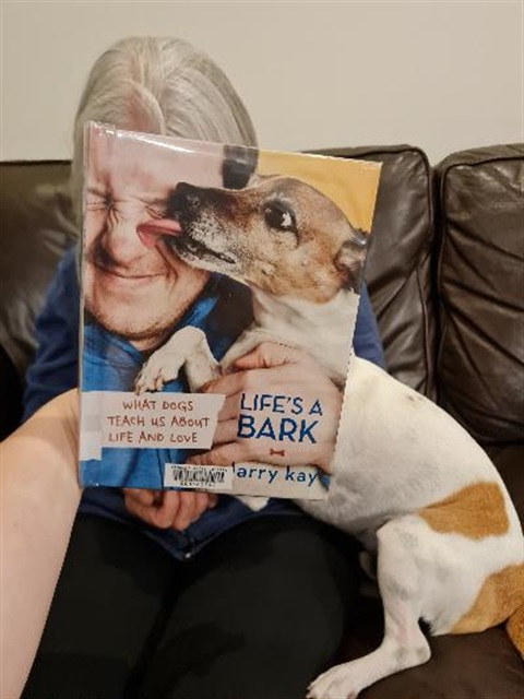 Book cover with lady and dog